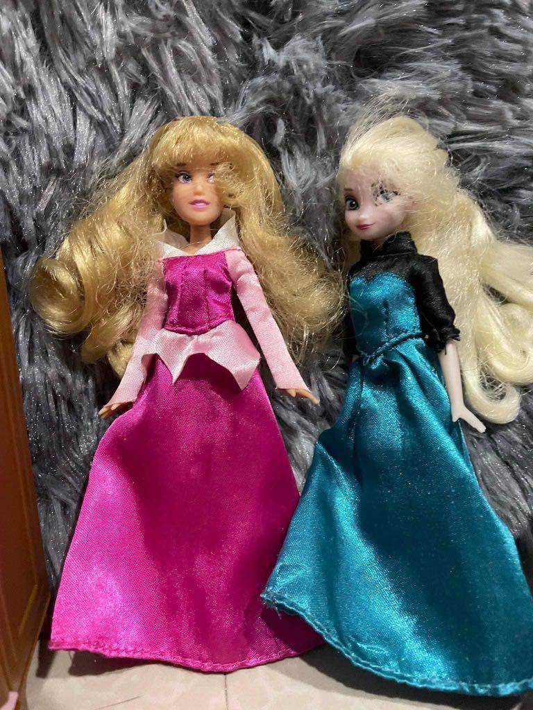 Elsa and aurora toy (Category: Kids Toys) located in Imus. Submitted by pocketfullofcandies (Listing ID 1151053656, Image 3). Description: Frozen elsa and aurora doll with extra clothes, manewuin, cabinet, and a bed with flaw sa leg part. Doll in good condition. Cabinet is very cute .