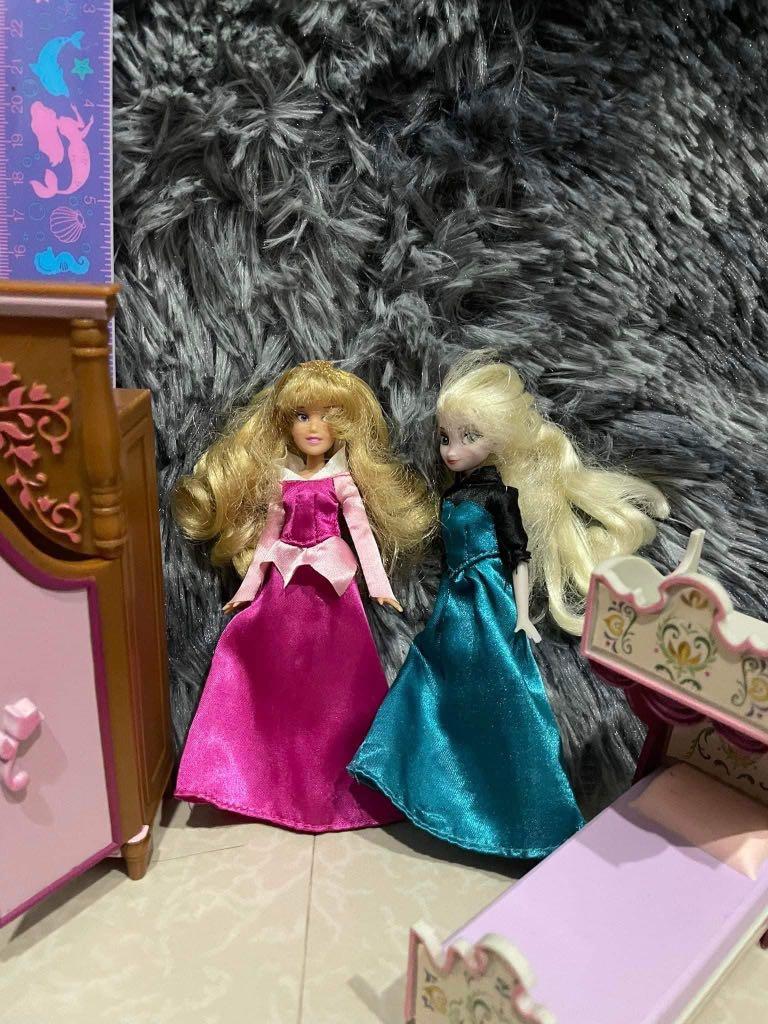 Elsa and aurora toy (Category: Kids Toys) located in Imus. Submitted by pocketfullofcandies (Listing ID 1151053656, Image 1). Description: Frozen elsa and aurora doll with extra clothes, manewuin, cabinet, and a bed with flaw sa leg part. Doll in good condition. Cabinet is very cute .