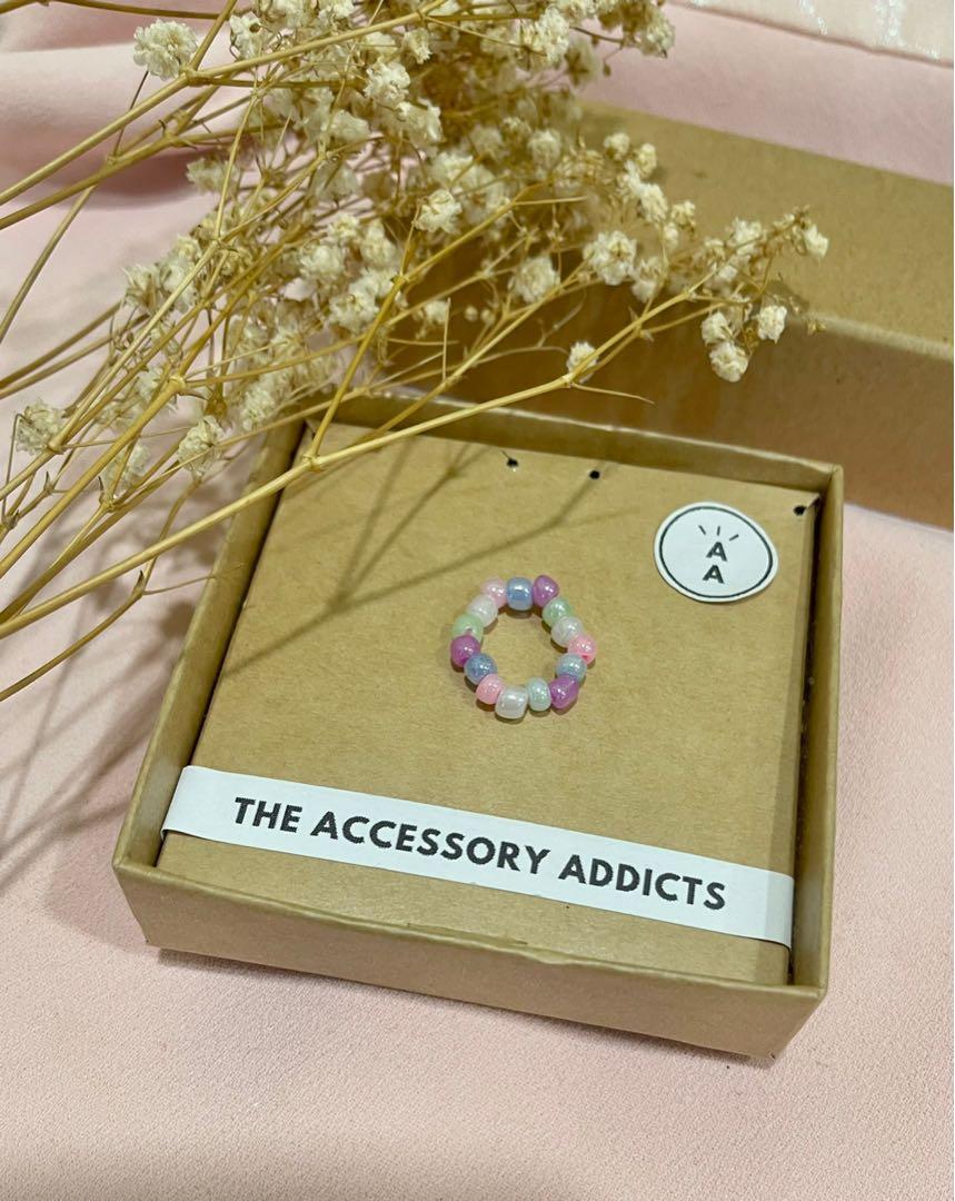 beaded ring (Category: Rings) located in Singapore. Submitted by theaccessoryaddicts (Listing ID 1151292782, Image 1). Description: more designs avail elastic string can add smiley face / initial + $0.50.