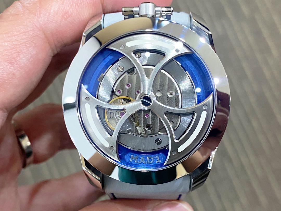 Like New Complete MB&F MAD 1 M.A.D 1 Blue (Category: Watches) located in Singapore. Submitted by thetimeco (Listing ID 1151217364, Image 1). Description: Hello guys! Up for grab and only worn less than 3 times in a like new condition, the unique battle axe rotor and time reading from the side in a 42mm MB&F Mad 1 watch produced and available only to the members of MB&F! Comes in a complete set dated 2021. Condition of timepiece at 9.9 / 10 ——————