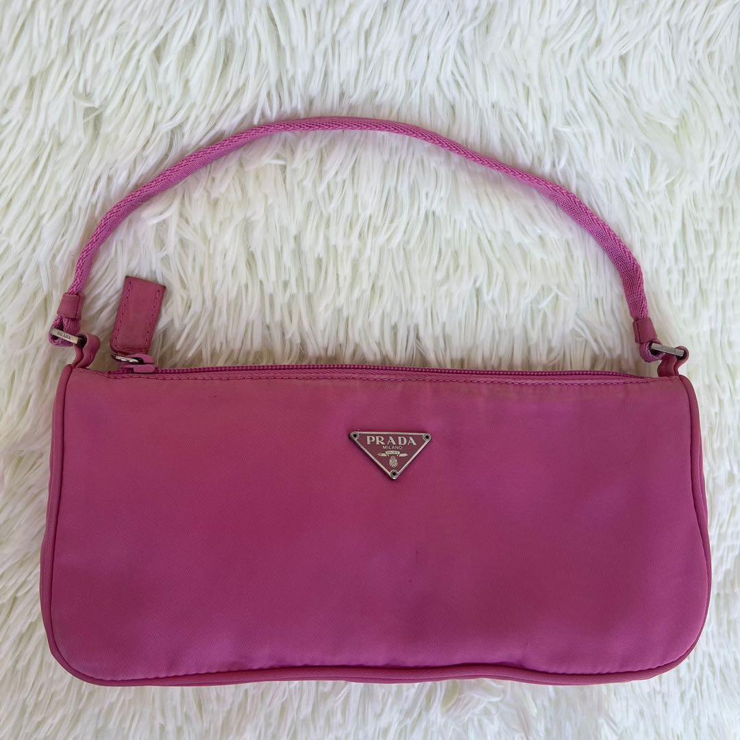 Prada Baguette Bag (Category: Luxury Bags & Wallets) located in Las Pinas. Submitted by Le.Pattie.Luxe (Listing ID 1151293186, Image 2). Description: Authentic Pink Prada Baguette Bag 💖Php 13k only💖 Inclusion: provided dustbag With small stain at the back Slight discoloration Approx. Dimensions: 9.5 x 4.5 x 2.5in (LxHxW) Can be worn shoulder bag/hand bag.