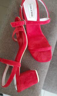 Red strappy shoes