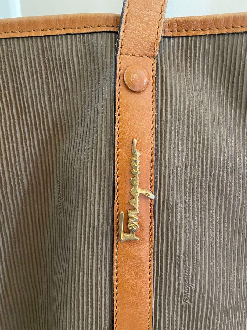 Authentic Ferragamo tote bag (Category: Luxury Bags & Wallets) located in Batangas. Submitted by iammrs (Listing ID 1151812719, Image 3). Description: Authentic Ferragamo bag. No major flaws but has scratches and rubs on leather parts. Please lower expectations thats why im selling it low. It comes with pouch. No lowballing please.