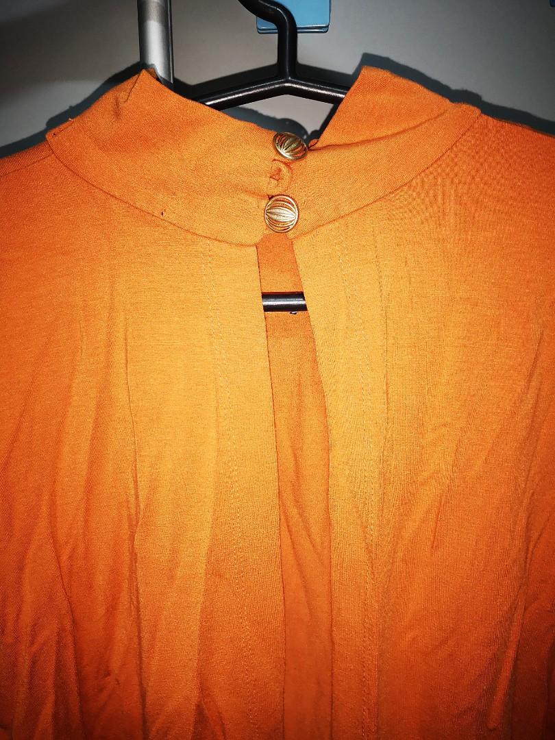 Orange top (Category: Blouses) located in Quezon City. Submitted by rubykindipan (Listing ID 1146909211, Image 2). Description: Missing 1 button.