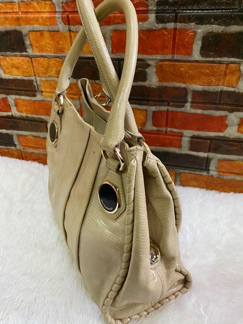 Authentic Bruno Magli Snakeskin Hobo bag (Category: Luxury Bags & Wallets) located in Cagayan de Oro. Submitted by riggstuffs (Listing ID 1152118969, Image 3). Description: Guaranteed Authentic Bruno Magli Snakeskin Hobo Bag It is in cream color and material is made of soft snakeskin leather No major flaws, no rubs at the corner, no rips or cracks in the material A little sign of use The Interior is very clean with 3 compartments Hardware are sti