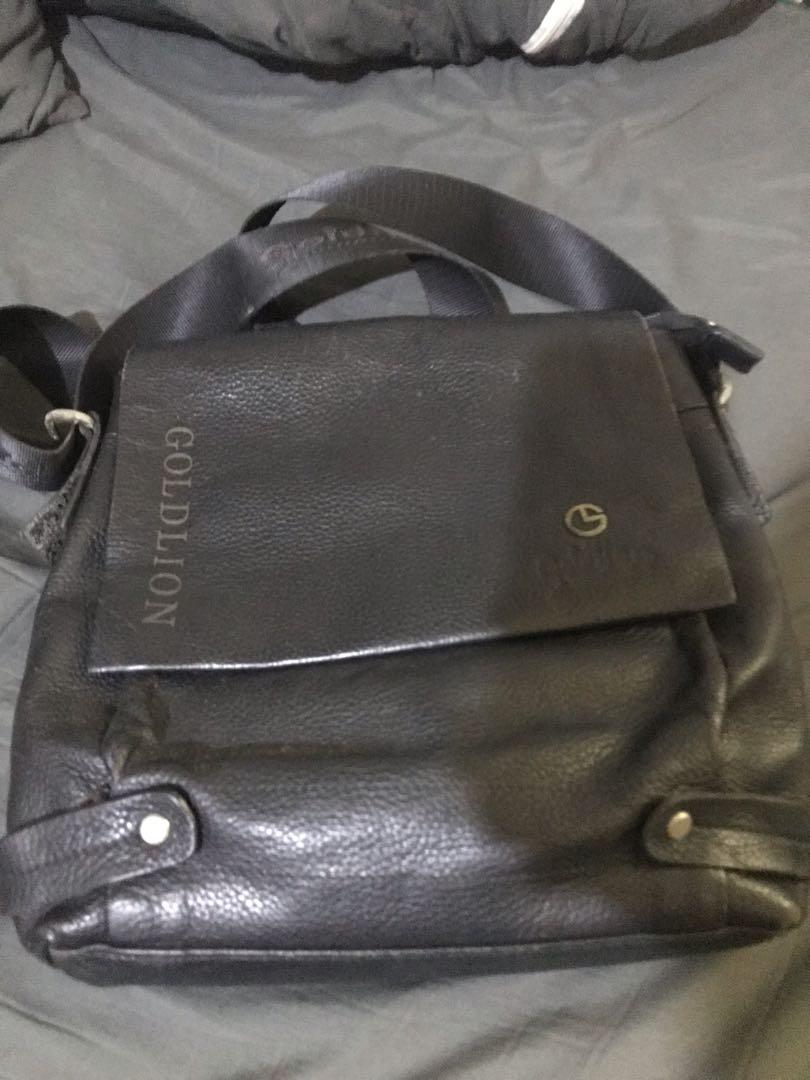 Gold Lion leather sling unisex (Category: Sling Bags) located in Manila. Submitted by kdan29 (Listing ID 1152036497, Image 1). Description: Used Gold Lion sling bag Black Leather Signs of use.