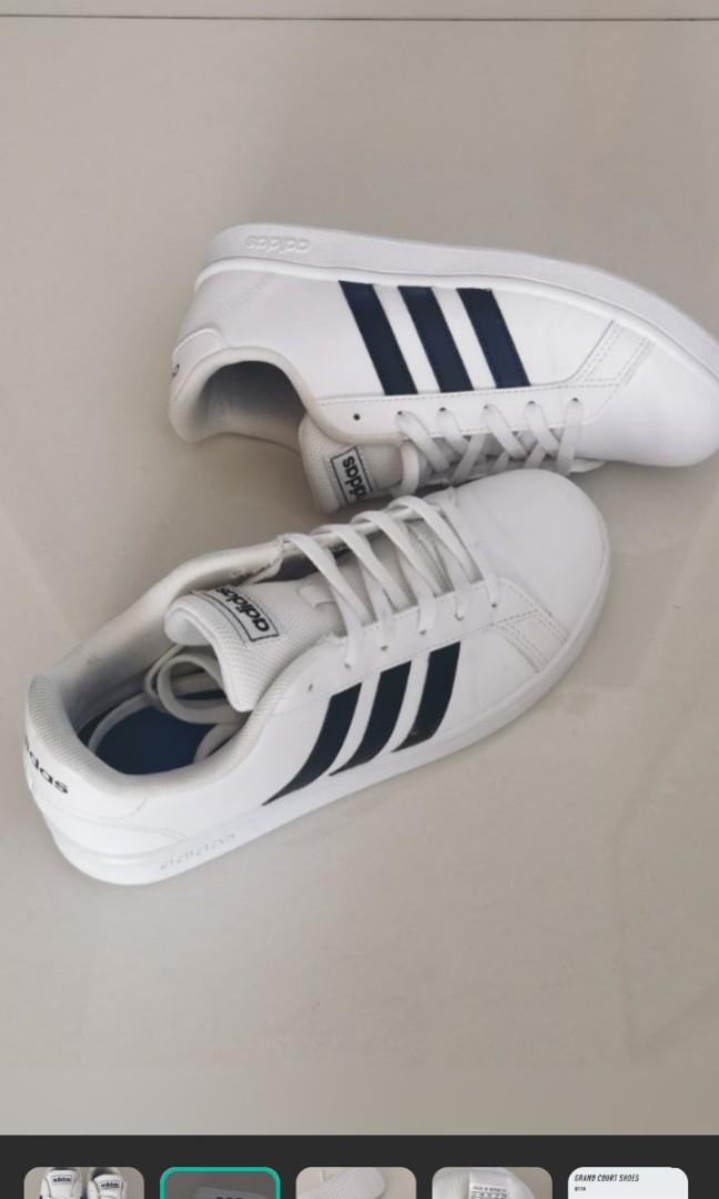 adidas white shoes with black stripes on one side