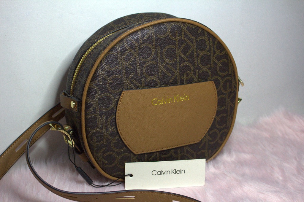 Calvin Klein Round Signature Crossbody in Brown