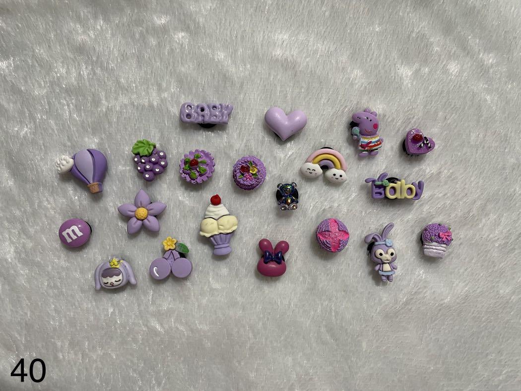 CROCS CHARMS/JIBBITZ PER SET IN VIOLET #40 👾 (Category: Shoe inserts) located in Pasig City. Submitted by mingmingbuys (Listing ID 1147091018, Image 1). Description: FIXED PRICE MGA SISZT. NAGMAHAL NA SA SUPPLIER. 20 PCS PER PACK WALA PONG PILIAN. CUTE PO AND GOOD QUALITY. LOWEST PRICE PADIN MGA SIS. PM ME IF YOU HAVE QUESTIONS. 🥰.