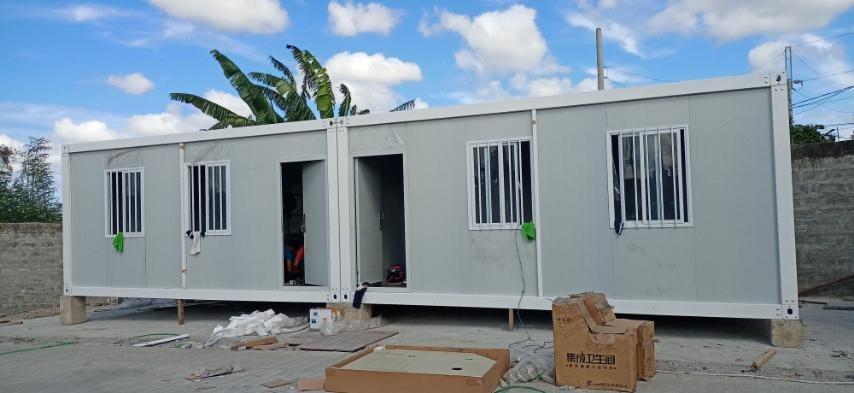 Prefab Container House (20ft) (Category: Construction & Building Materials) located in Manila. Submitted by agelang11 (Listing ID 1146916992, Image 2). Description: Pre-Fab Container House External Size: 5950mm x 3000mm x 2800mm Internal Size: 5750mm x 2800mm x 2550mm 2.3mm Steel Structure 50mm EPS Wall Panels with 0.3mm Steel Sheets 2 Aluminum Alloy Single Glass Window 1 Steel Door 16mm MGO Floor Free: 2 LED lights 1 box switch (2 switches) 2 ou