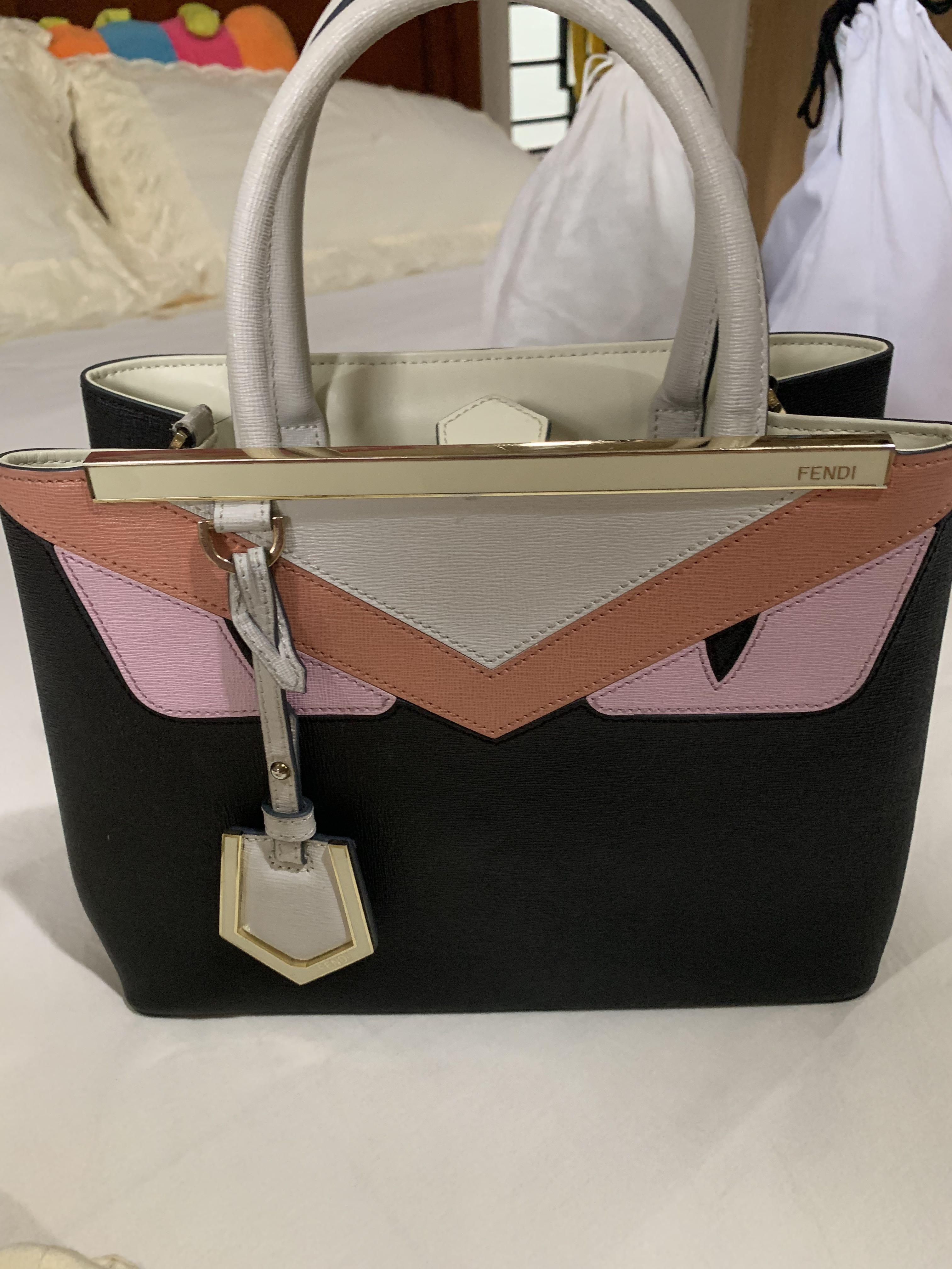 Fendi Monster Bag (Category: Luxury Bags & Wallets) located in Quezon City. Submitted by butterflymom16 (Listing ID 1147107906, Image 2). Description: Fendi 2 Jours Monster Bag Tri-color Black, White and Pink Cross body, hand bag Excellent Condition A little fade on the handle, not that noticeable. No scratch, no stains on the metal part. See photos. Fendi dust bag only Free Piumelli Flower strap .