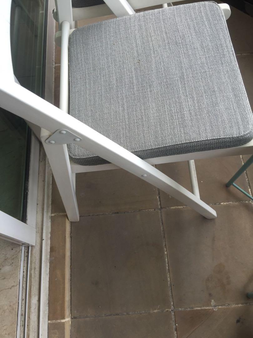 Outdoor Ikea used small grey table with 2 x white chairs. Note as shown in photos chairs have