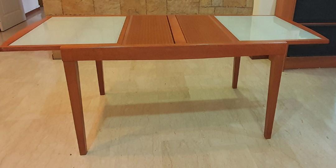 Solid wood Dining Table (Extendable) (Category: Tables & Sets) located in Singapore. Submitted by peanutbutternjam (Listing ID 1147128015, Image 2). Description: Extendable Dining table with tempered glass top. Well maintained. Table Size before extension: Length: 1430 x Width: 850mm Table length after full extension: 2060mm Not inclusive delivery. Price negotiable..