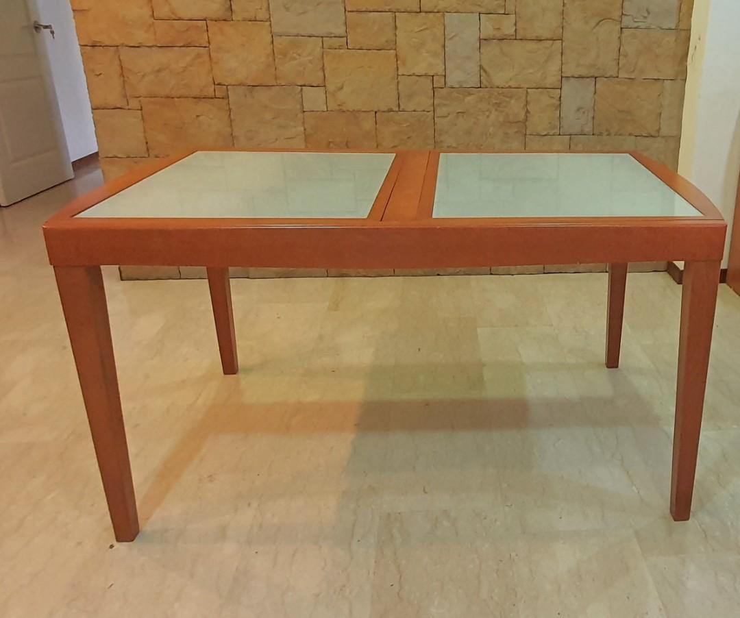 Solid wood Dining Table (Extendable) (Category: Tables & Sets) located in Singapore. Submitted by peanutbutternjam (Listing ID 1147128015, Image 1). Description: Extendable Dining table with tempered glass top. Well maintained. Table Size before extension: Length: 1430 x Width: 850mm Table length after full extension: 2060mm Not inclusive delivery. Price negotiable..