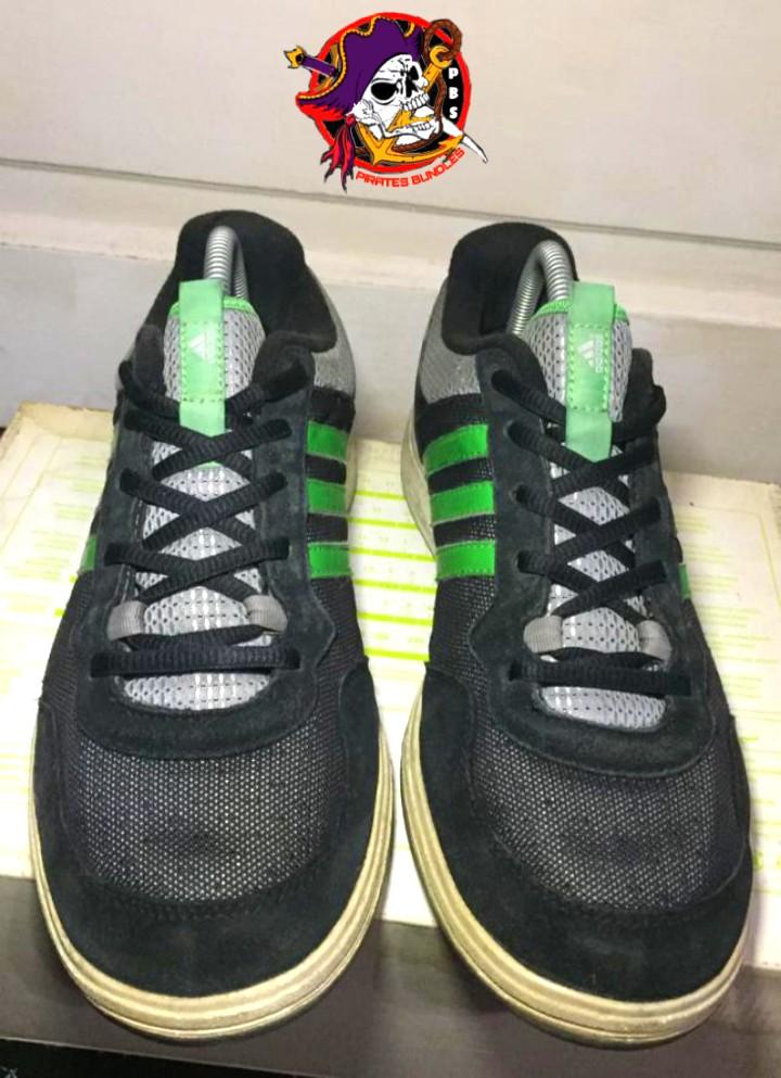Black adidas clearance with green stripes