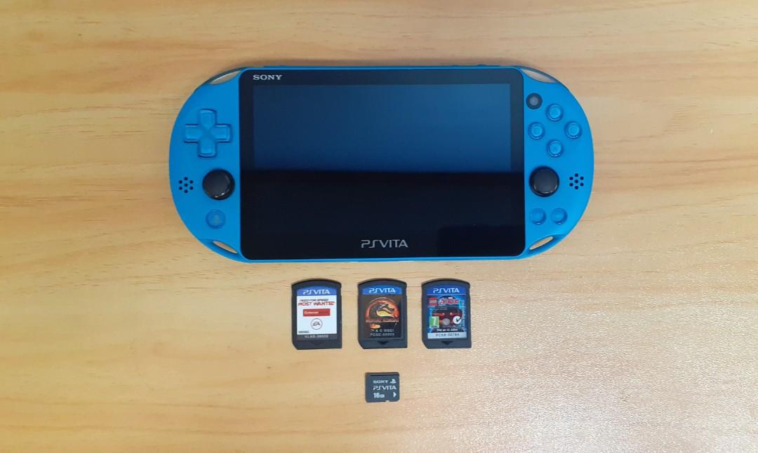 Ps vita slim aqua blue with 16gb memory card and three games 