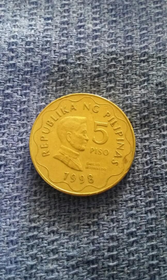 5 piso bsp series 1998(rcm) error coin (Category: Currency) located in Candon. Submitted by sniper_25 (Listing ID 1147999402, Image 2). Description: - 5 piso bsp series 1998(rcm) royal Canada mint(error coin). - extra metal on cogwheel teeth.