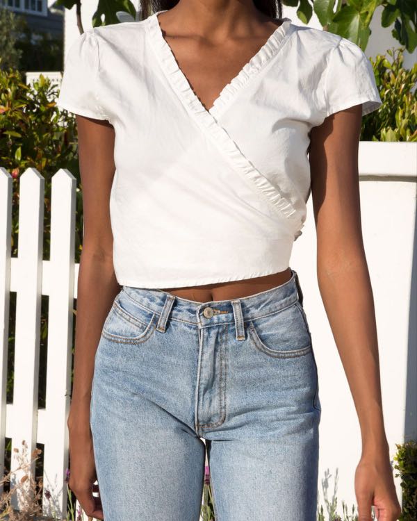 authentic brandy melville white ruffle rae wrap tie top, Women's Fashion,  Tops, Blouses on Carousell