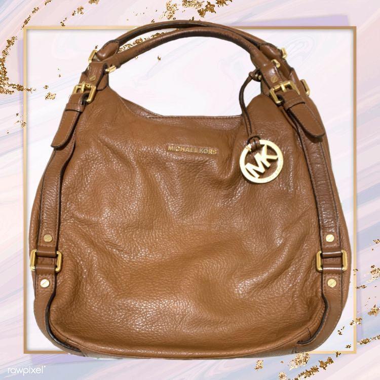 MICHAEL KORS HANDBAG, black leather with two top handle and gold tone  hardware and shoulder chain strap, bottom feet, snap closure, cream  monogram interior, front lock with key, dust bag, 38cm x