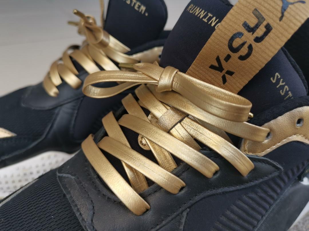 puma rsx trophy black gold