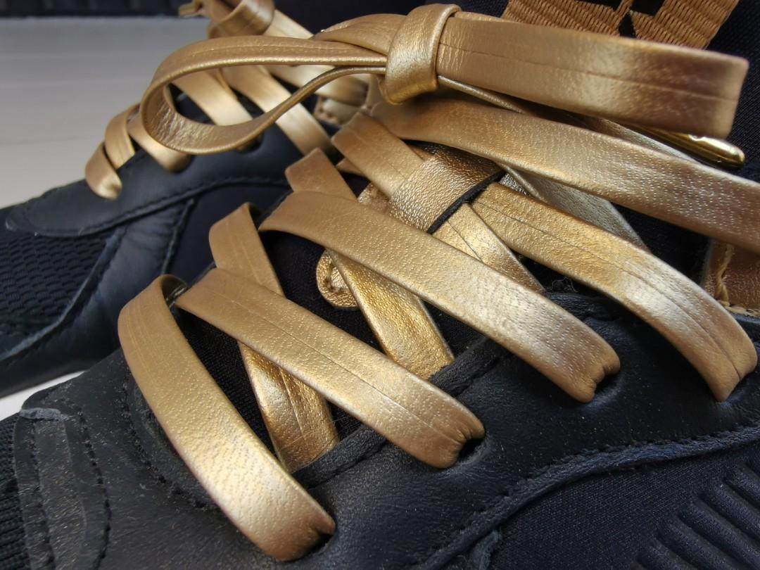 puma rsx trophy black gold