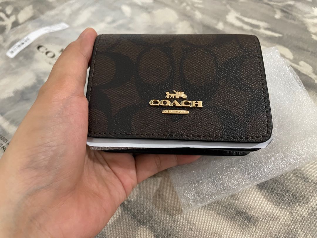 Coach mini wallet on chain, Luxury, Bags & Wallets on Carousell