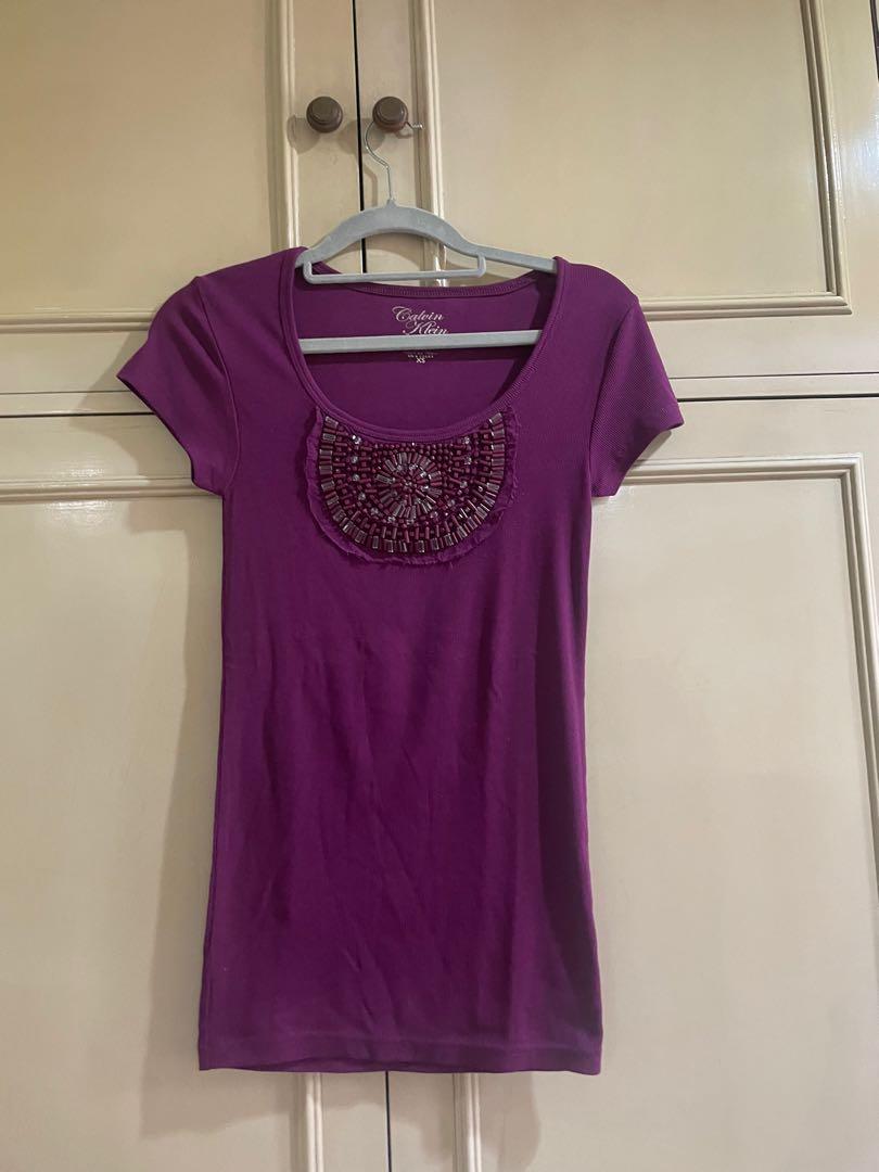 Calvin Klein beaded shirt (Category: Shirts) located in Quezon City. Submitted by jujuloco (Listing ID 1154568200, Image 1). Description: Brand new no tags Calvin Klein beaded shirt Given as a gift to me. Just stored. Thread on back side lower stitching is off but not obvious and will not be seen if tucked in (see pic) Gcash or bpi Shipping care of buyer.