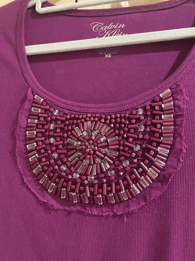 Calvin Klein beaded shirt (Category: Shirts) located in Quezon City. Submitted by jujuloco (Listing ID 1154568200, Image 2). Description: Brand new no tags Calvin Klein beaded shirt Given as a gift to me. Just stored. Thread on back side lower stitching is off but not obvious and will not be seen if tucked in (see pic) Gcash or bpi Shipping care of buyer.