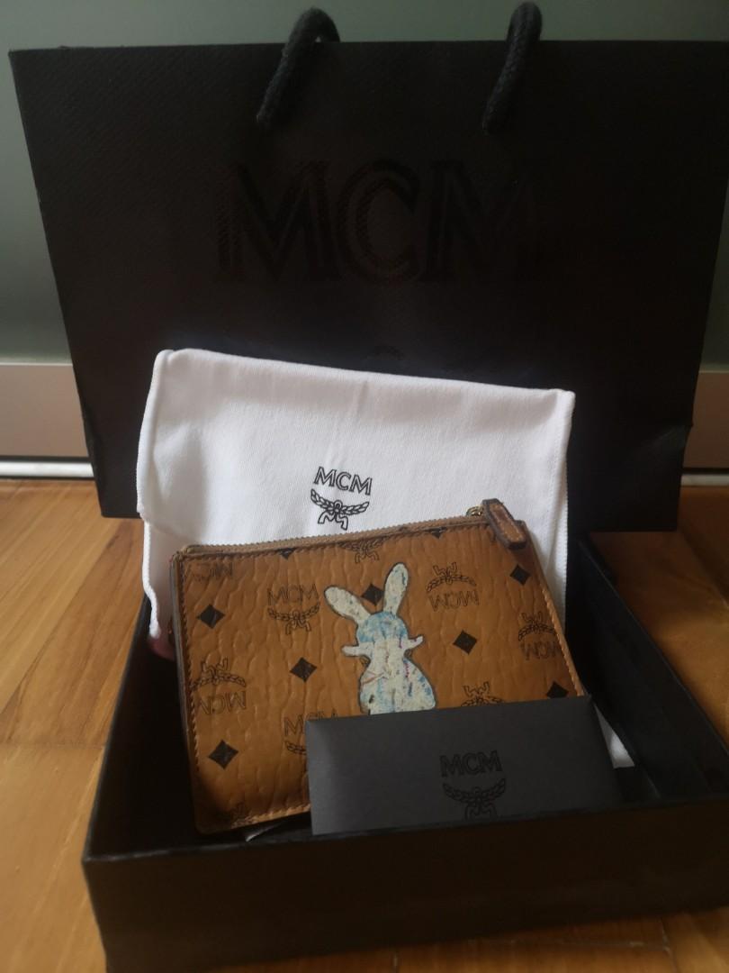 Mcm pouch (Category: Accessories) located in Singapore. Submitted by trish.lim (Listing ID 1154635678, Image 1). Description: MCM Pouch. Able to fit cards, notes, coins Condition all good just slightly dirty. Comes with full set..
