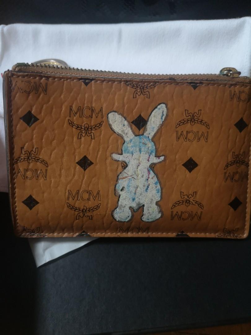 Mcm pouch (Category: Accessories) located in Singapore. Submitted by trish.lim (Listing ID 1154635678, Image 3). Description: MCM Pouch. Able to fit cards, notes, coins Condition all good just slightly dirty. Comes with full set..