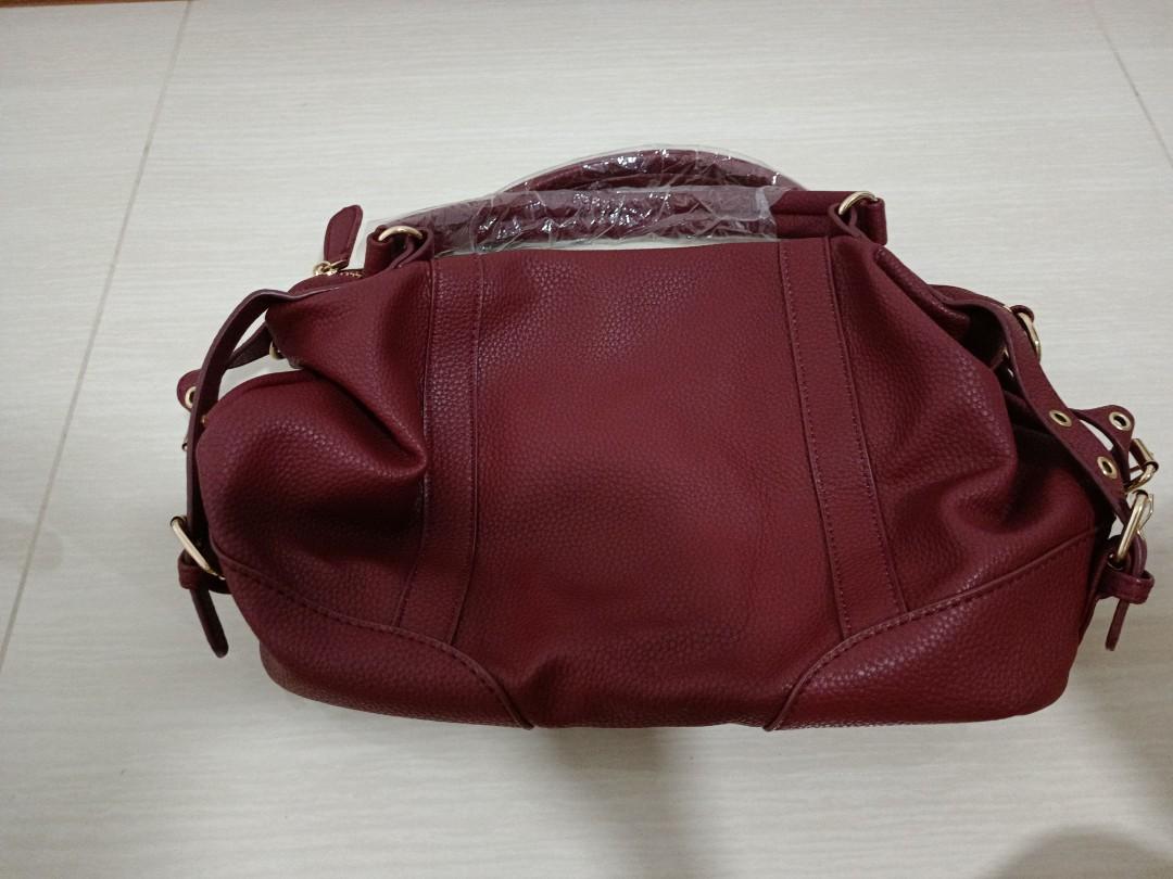 Maroon handbag on sale