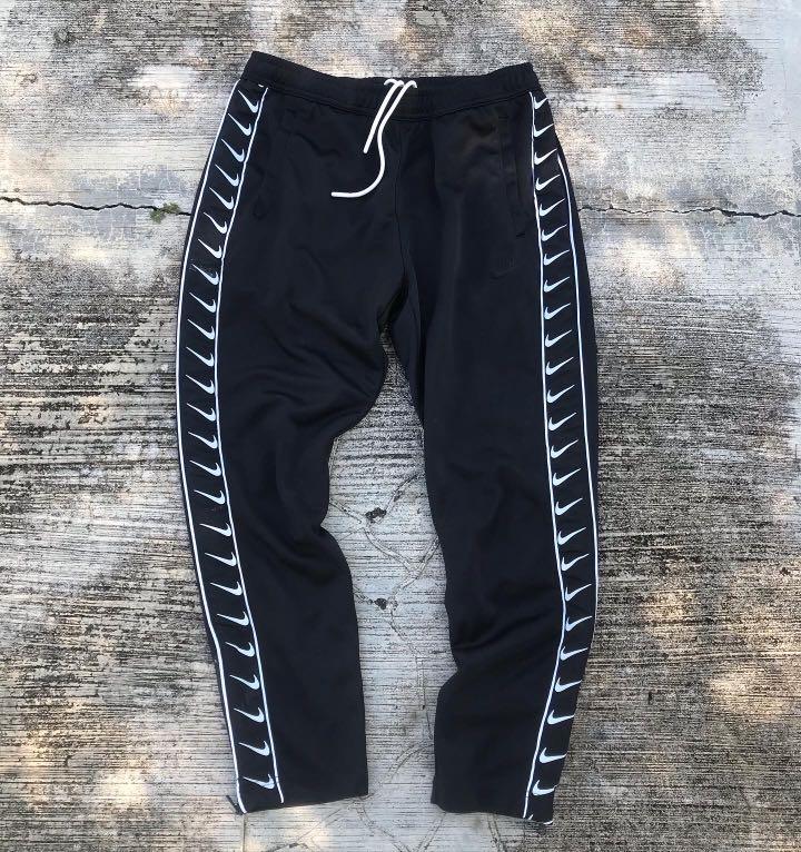 Nike swoosh hot sale taped track pants
