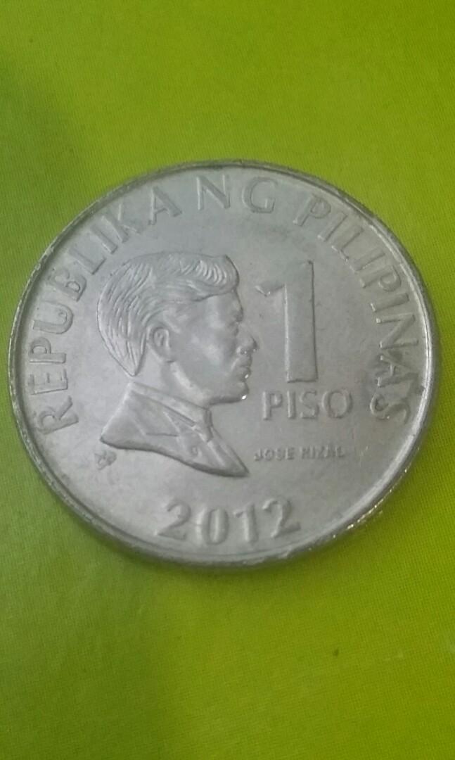 1 piso BSP series 2012(error coin) (Category: Currency) located in Candon. Submitted by sniper_25 (Listing ID 1155361432, Image 1). Description: 1 piso BSP series 2012(error coin) error on back excess on cogwheel teeth....