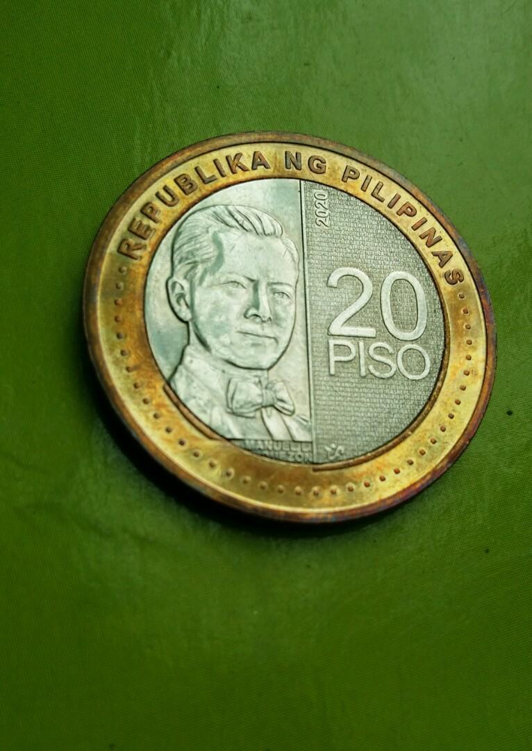 20 pesos NGC 2020 (error coin) (Category: Currency) located in Candon. Submitted by sniper_25 (Listing ID 1155366460, Image 3). Description: - 20 pesos NGC series 2020(error coin) - excess on part of the portrait(overlap) & on the inner circle,also on Quezon....