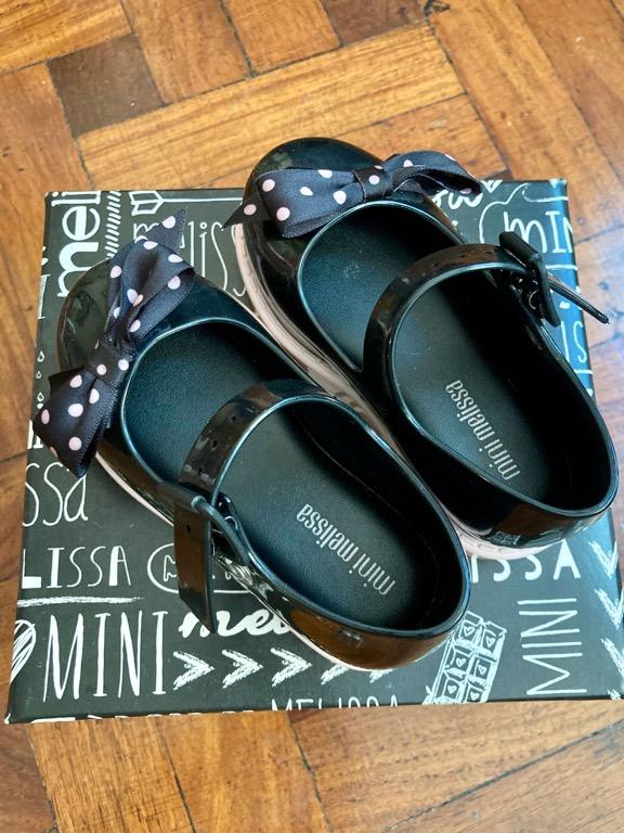 Mini Melissa black sandals size 7 (Category: Babies & Kids Fashion) located in Makati City. Submitted by tinkrbelle (Listing ID 1155359179, Image 2). Description: Authentic Mini Melissa Maggi Black Bow Sandals size 7 Bought from Melissa Pop-up Shop, Glorietta 3, Makati Original price at Php2,250. This beloved Mini Melissa Ultragirl, with its traditional oversized bow with polka dots, has a soft insole which keeps little feet happy and an adjustab