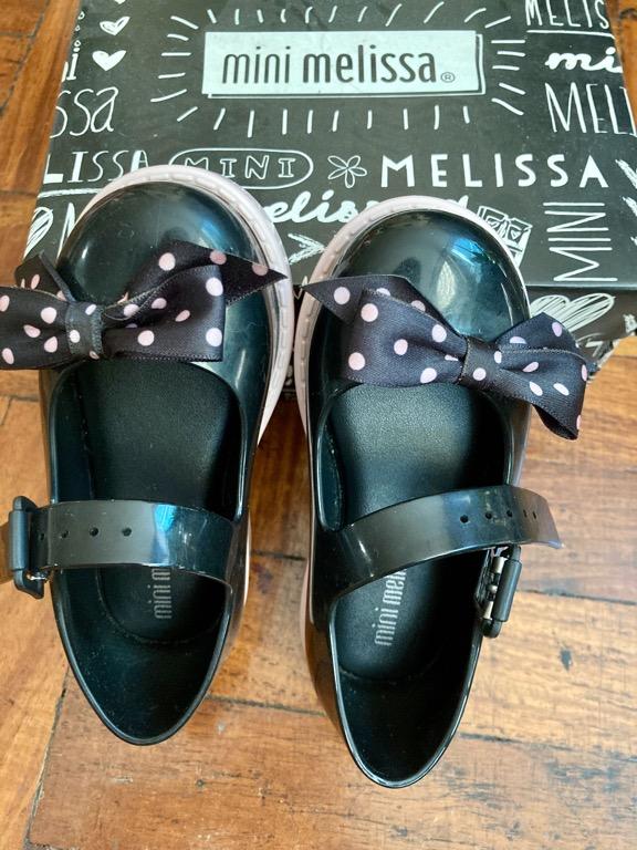 Mini Melissa black sandals size 7 (Category: Babies & Kids Fashion) located in Makati City. Submitted by tinkrbelle (Listing ID 1155359179, Image 1). Description: Authentic Mini Melissa Maggi Black Bow Sandals size 7 Bought from Melissa Pop-up Shop, Glorietta 3, Makati Original price at Php2,250. This beloved Mini Melissa Ultragirl, with its traditional oversized bow with polka dots, has a soft insole which keeps little feet happy and an adjustab