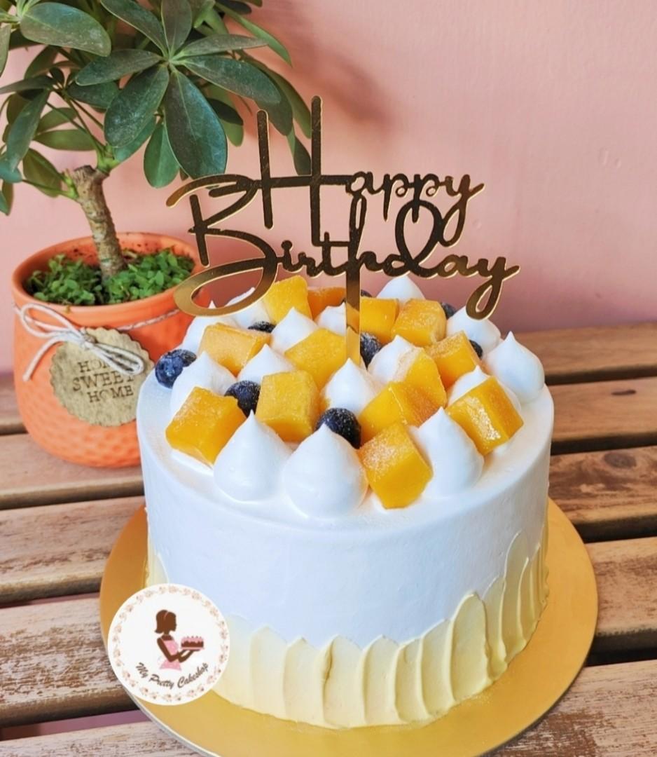delicious almond mango cake with mango curd topping