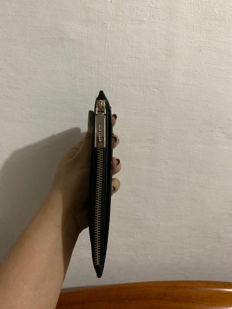 Kate Spade staci large slim card holder (Category: Wallets & Card holders) located in Binangonan. Submitted by cocoeyber (Listing ID 1155887595, Image 2). Description: Selling my preloved kate spade card holder. Rfs: will buy yung mas maliit ☺️ open rin for swap na black ks wallet yung cardholder na black.