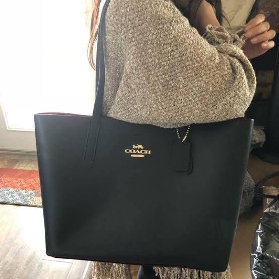 Coach black tote on sale with red interior