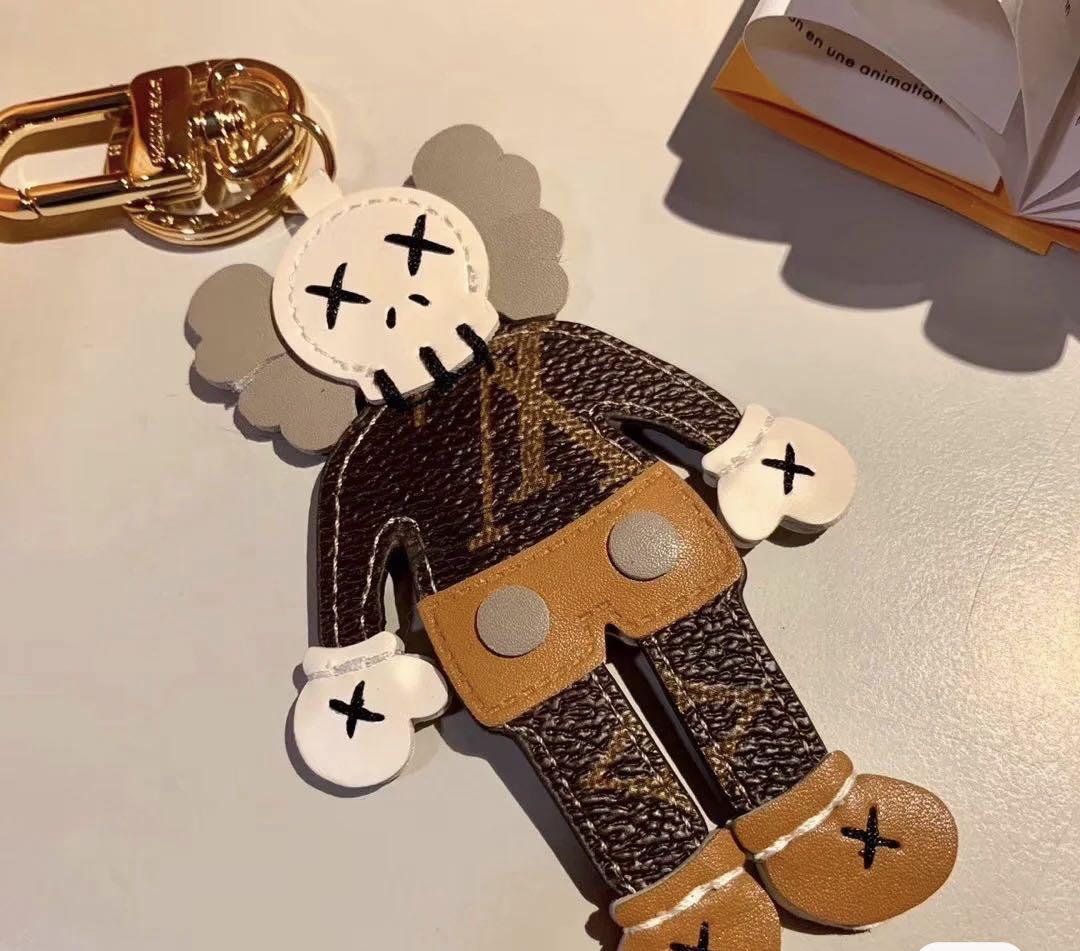 Kaws x LV louis vuttion Keychain bag charms, Men's Fashion, Watches &  Accessories, Wallets & Card Holders on Carousell