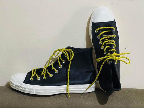black converse with yellow laces