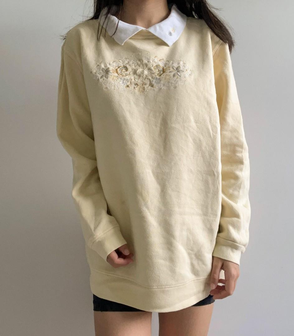 White top embroidered sweater