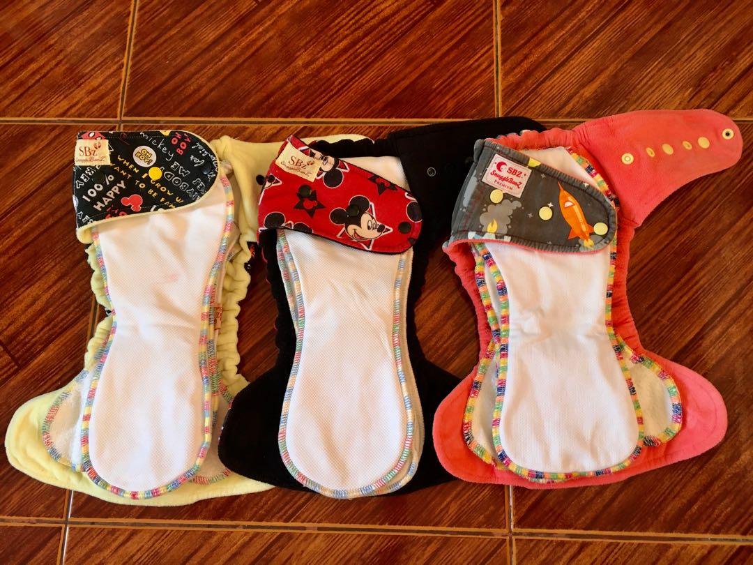 Cloth diaper TAKE ALL (Category: Diapers & Baby Wipes) located in Taguig. Submitted by j.marasigan (Listing ID 1152681620, Image 3). Description: Cloth diapers for sale Hybrid fitteds Pul Soakers Windpro Hobf Euc, vguc Message me for more details Snugglebunz Happy tush Abc by zoe Rockbaby/ecobum The green stitch SBZ HF LOT 3,500 **with freebies TOP ROW (SIDE SNAPPED) Pawpatrol EUC-VGUC 👉🏻600 School EUC 👉🏻 600 Pets (us fab) EUC 👉🏻750 BOTTOM 
