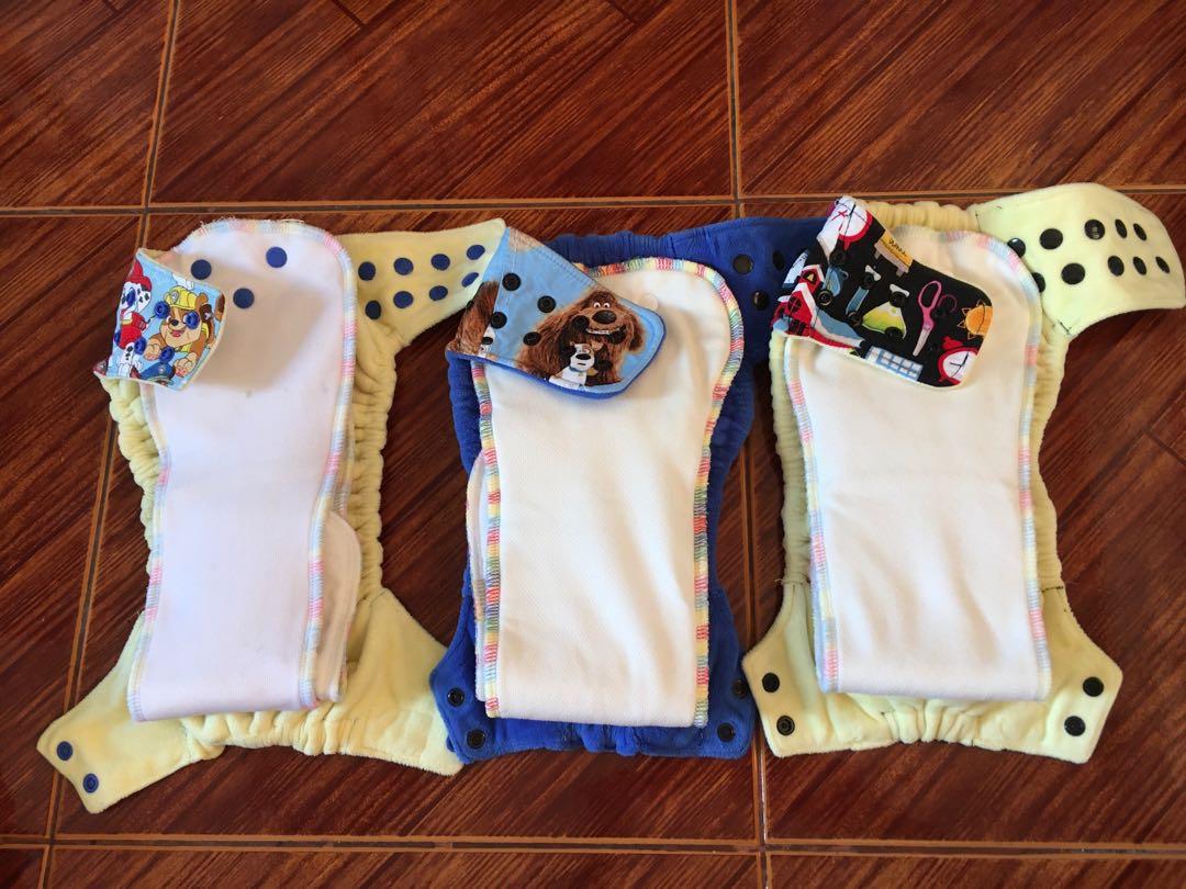 Cloth diaper TAKE ALL (Category: Diapers & Baby Wipes) located in Taguig. Submitted by j.marasigan (Listing ID 1152681620, Image 2). Description: Cloth diapers for sale Hybrid fitteds Pul Soakers Windpro Hobf Euc, vguc Message me for more details Snugglebunz Happy tush Abc by zoe Rockbaby/ecobum The green stitch SBZ HF LOT 3,500 **with freebies TOP ROW (SIDE SNAPPED) Pawpatrol EUC-VGUC 👉🏻600 School EUC 👉🏻 600 Pets (us fab) EUC 👉🏻750 BOTTOM 