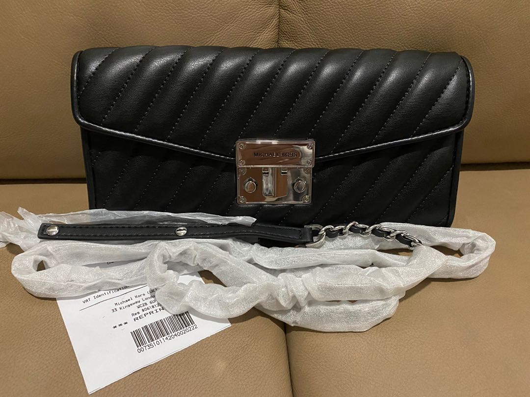 Michael kors black store clutch bag uk