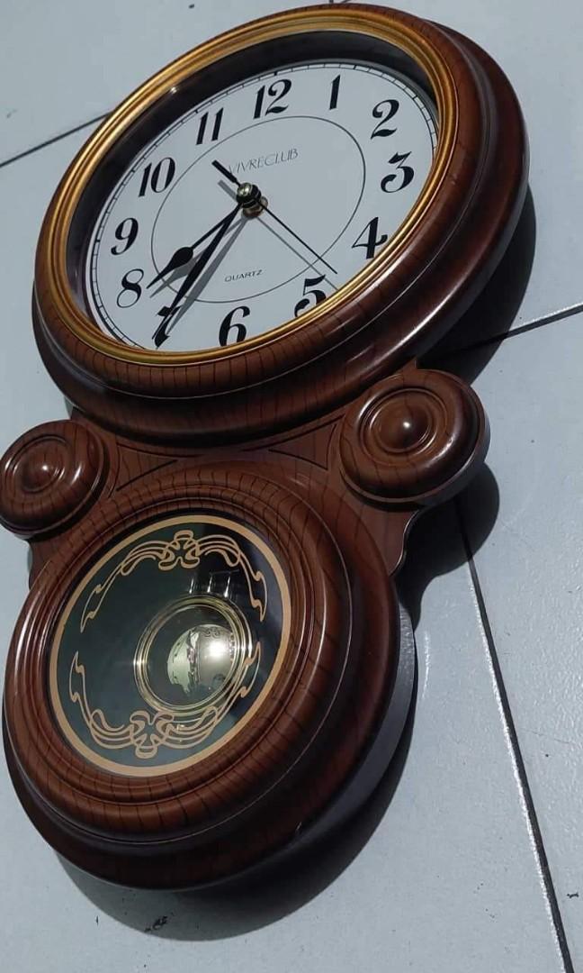 Pendulum wall clock (Category: Clocks) located in Caloocan City. Submitted by great_2003 (Listing ID 1156456191, Image 2). Description: good running condition brand new condition swinging pendulum used 4 pcs double battery chime every hour battery not included tested elegant classic look plastic case material as is only wysiwyg.