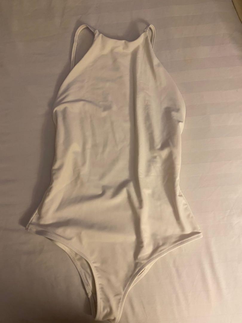 One piece open back (Category: Bikinis & Swimsuits) located in Cebu City. Submitted by vanmags (Listing ID 1156669439, Image 1). Description: Halter top style One piece Color white Rfs: decluttering.