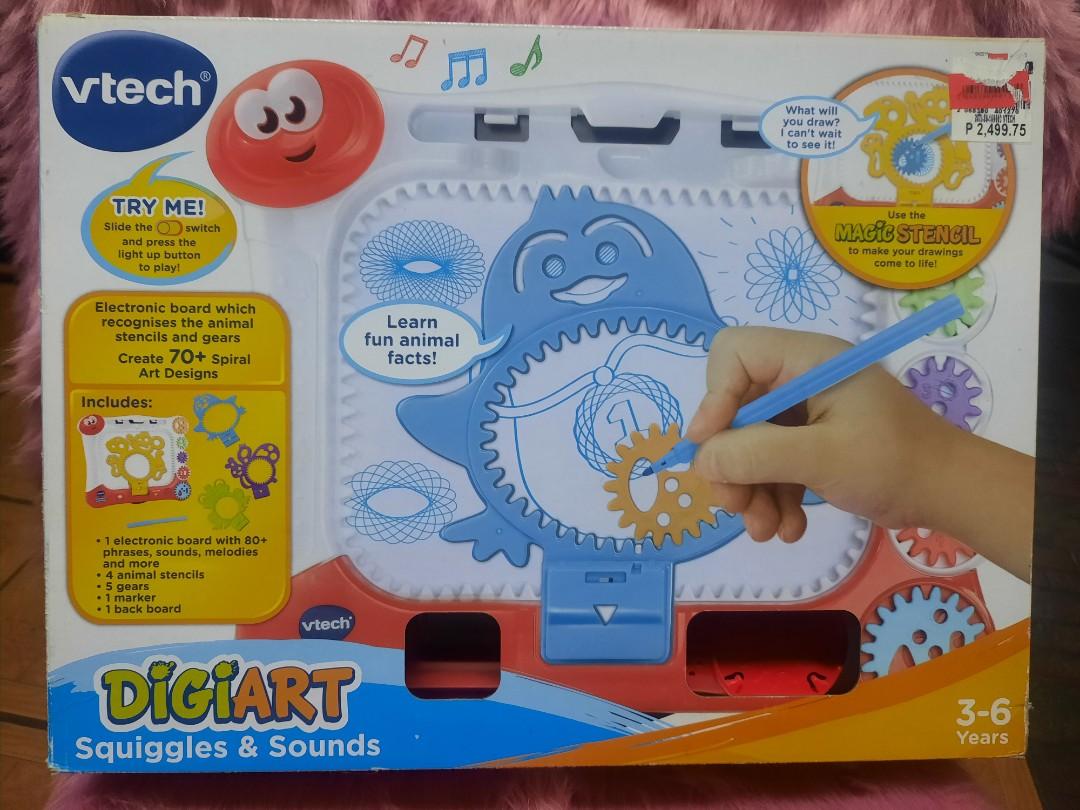 Vtech DigiArt (Category: Educational & Learning Toys) located in Paranaque City. Submitted by kaelstoypalace (Listing ID 1156649413, Image 1). Description: With the DigiArt Squiggles and Sounds by Vtech, your child is encouraged to discover and explore their creativity! Watch as they make their own magical spiral art using the 5 gears and 4 animal stencils! includes: 4 animal stencils 5 spiral gears 1 marker pen 1 spiral art board *batteries not 