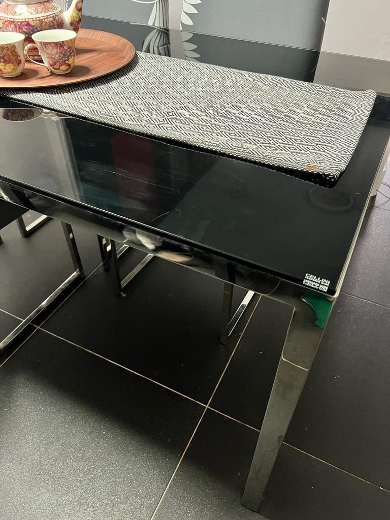 Dining sets (Category: Tables & Sets) located in Singapore. Submitted by mohdfai (Listing ID 1156732592, Image 2). Description: Cellini tampered glass dining table top with stainless steel frames/base, the table top has some hairline scratches.. dimensions: L140 cm x W 80 cm x H 74 cm 4 nos of chairs. Not for fussy buyers but overall the set has a very stylish and elegant look. Please arrange for your own transport, the the tampered glass top can