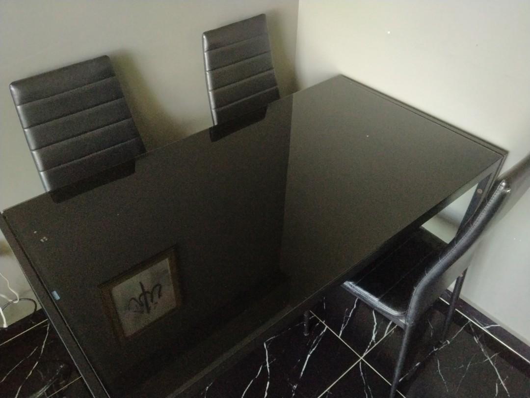 Dining table (Category: Tables & Sets) located in Singapore. Submitted by lanaimperio (Listing ID 1157184856, Image 3). Description: Black Dining Table only still in good condition. Tampered glass Table condition 8/10 If want chair, can take also but the condition of the chair is 5-6/10 self collect at punggol arrange own transport.